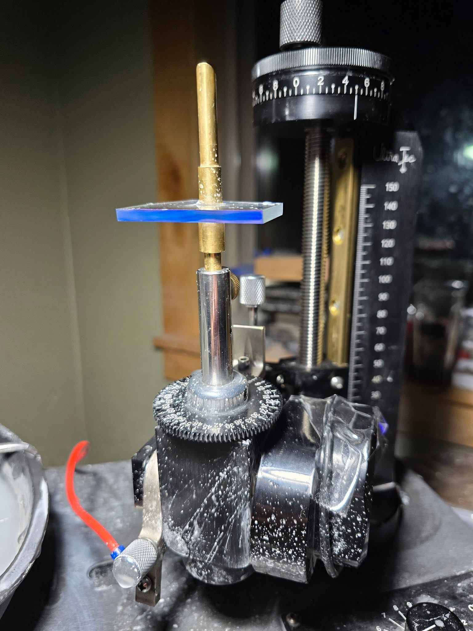 Gem preform mounted on the faceting handpiece